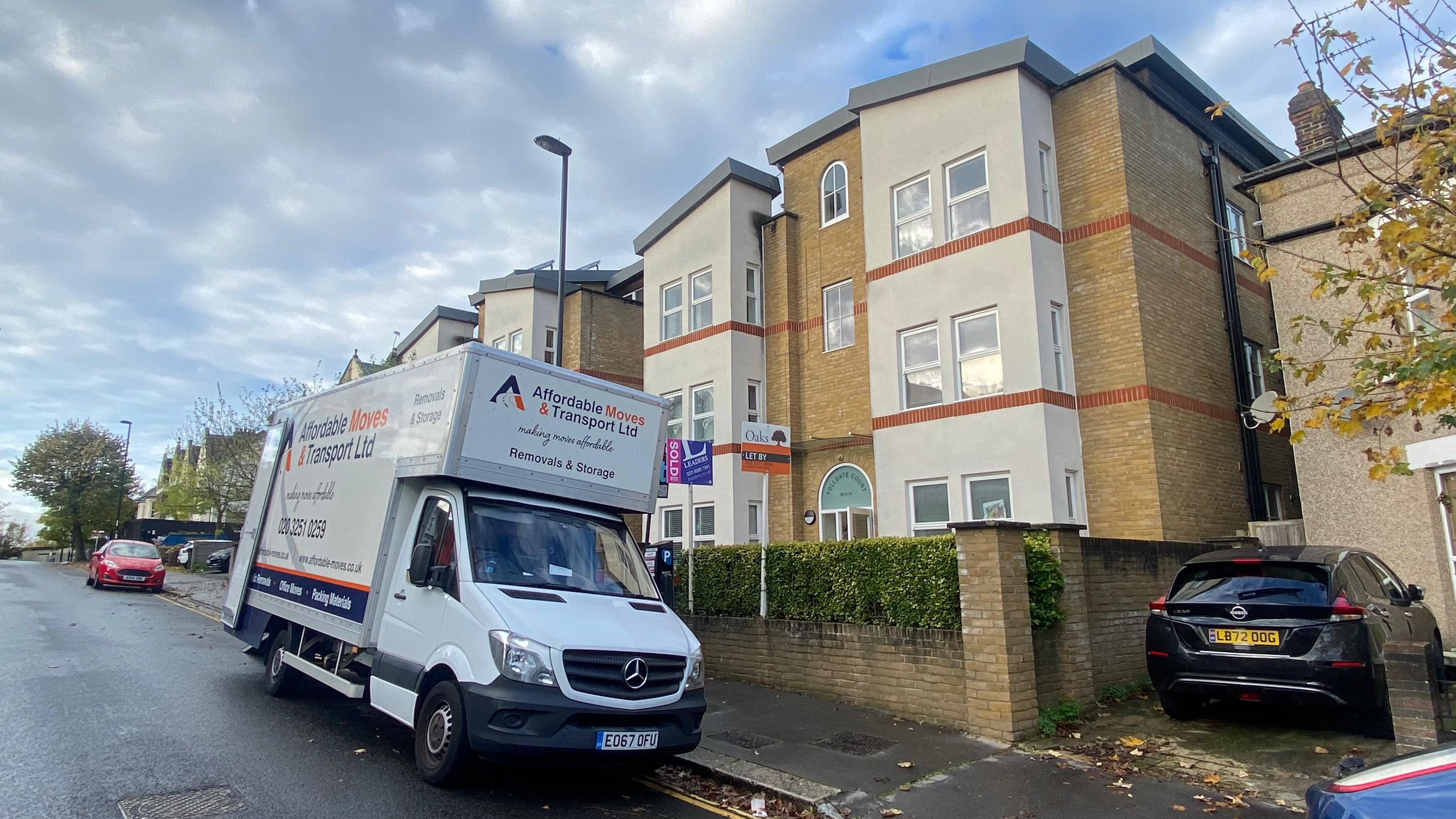 Professional office removals team carefully packing and moving business equipment